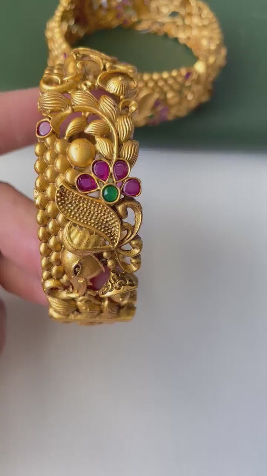 Gold plated kemp stone openable bangles with elephant flower carvings