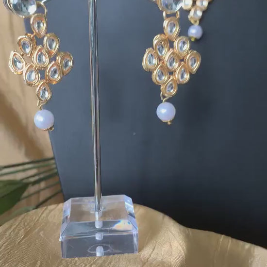 Gold plated kundan choker set with earrings and Maang tikka