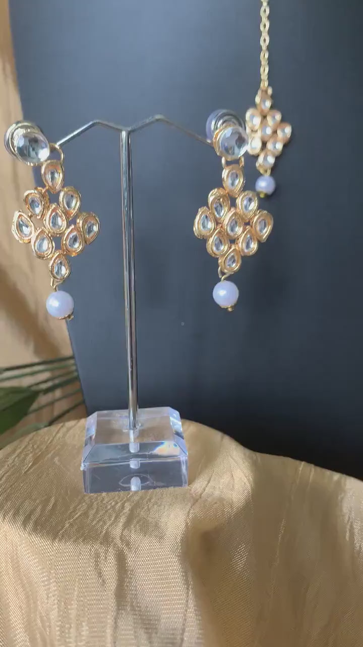 Gold plated kundan choker set with earrings and Maang tikka