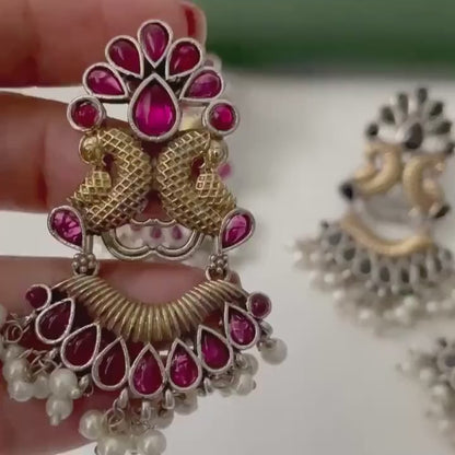 Oxidised dual tone peacock motif earrings