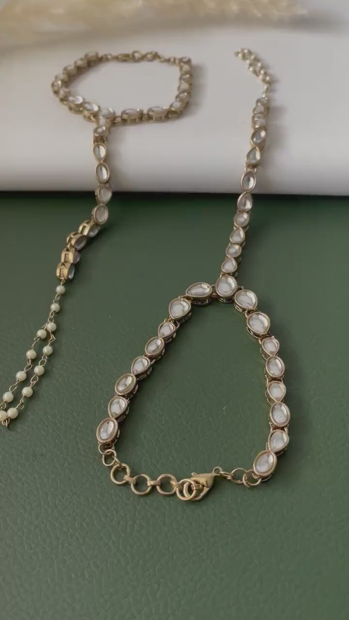 Antique gold colored kundan and pearl haath panja